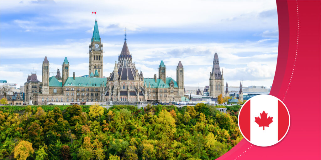 Canada's Parliament government buildings in Ottawa, Ontario, as viewed from the river (somewhat Gothic stone spires with green copper roofs.)